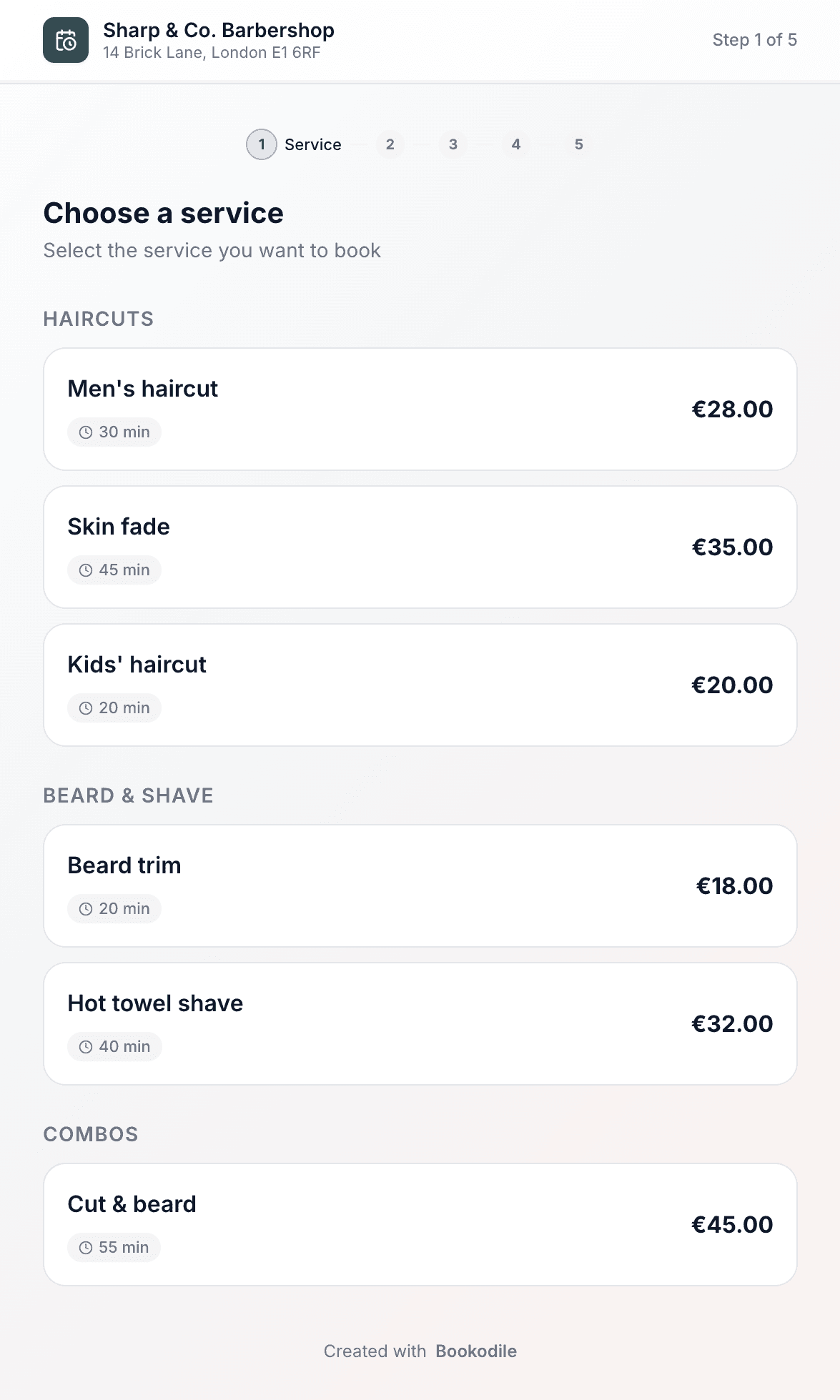 Public booking page showing services grouped by category with prices and durations