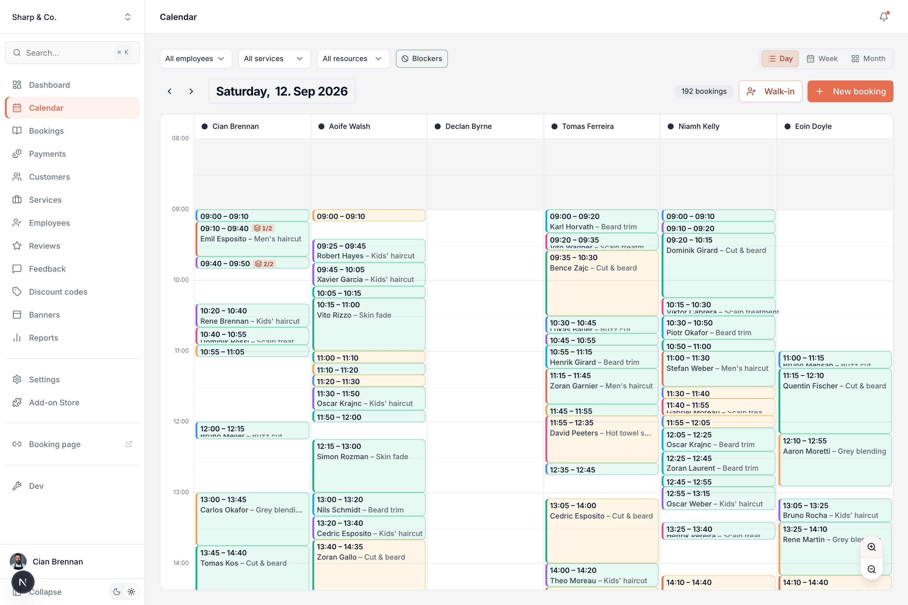 Day view with a column per team member, each packed with colour-coded appointments