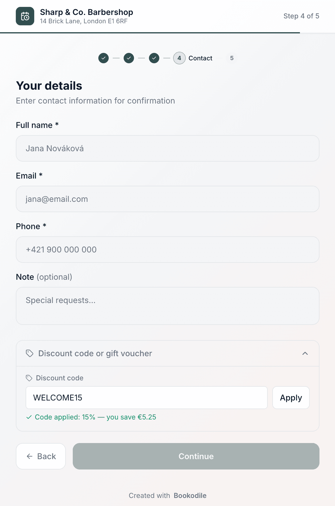 Public booking page showing a discount code applied with the saving shown in green