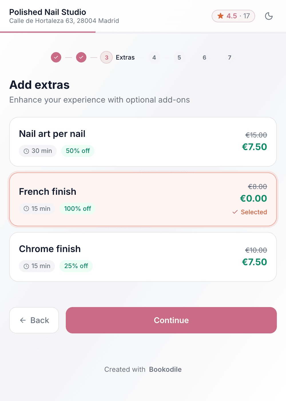 A nail salon's booking page on a phone, at the extras after a gel manicure: nail art at half price, a French finish free and ticked, a chrome finish at 25% off