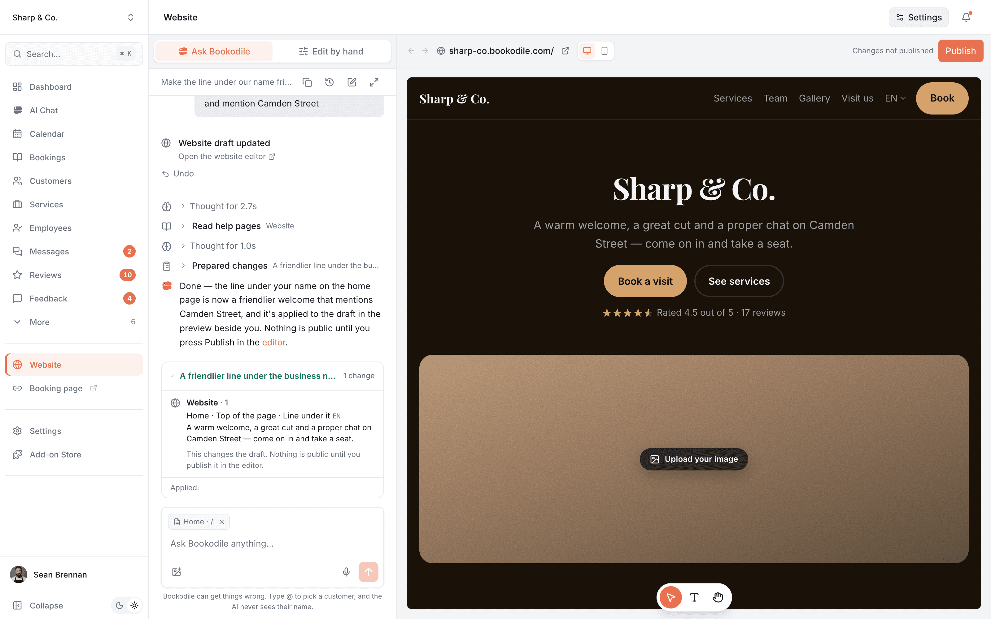 The website editor: Bookodile has rewritten the line under the business name on request, and the preview beside the chat already shows it, in the warmer look it was asked for earlier