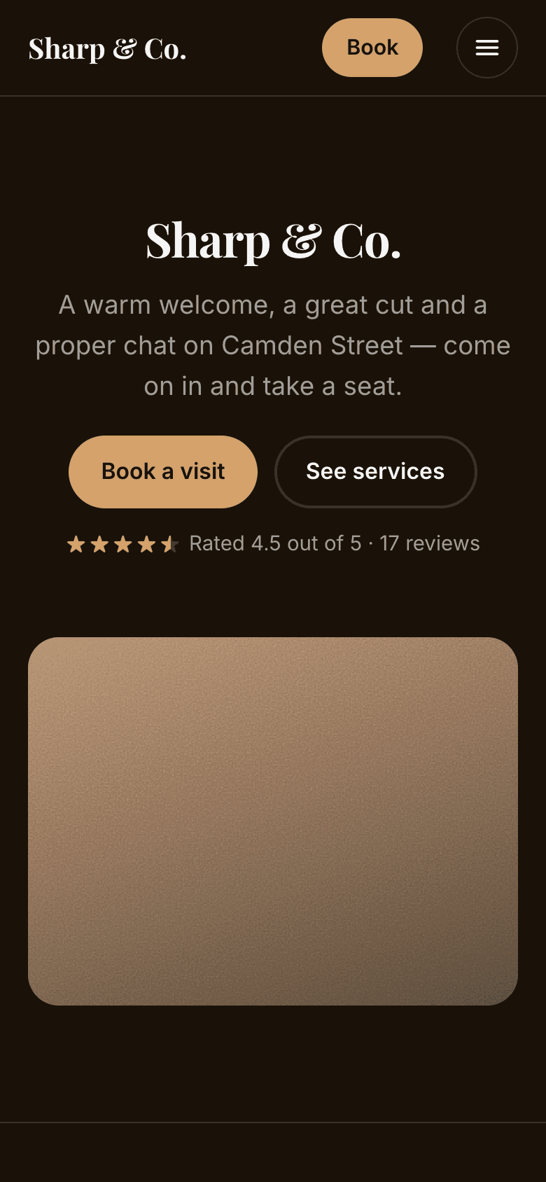The website's home page on a phone, with Book beside the menu at the top